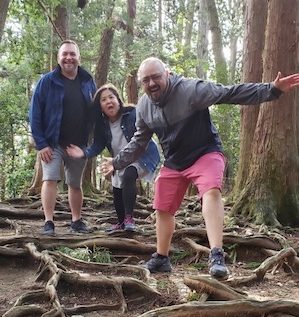 Board members of Reiki Centers of America, Brian Brunius, Diane Domondon, and Christopher Tellez, on top of Mount Kurama in Kyoto, Japan