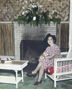 Photo of Hawayo Takata seated at the fireplace in 1951