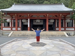 Photo of Christopher Tellez standing on the power spot in front of the Kurama-dera Temple. This is where the Circle of Oneness will happen in May 2022