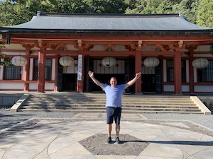 Photo of Brian Brunius in front of the main temple at Kurama