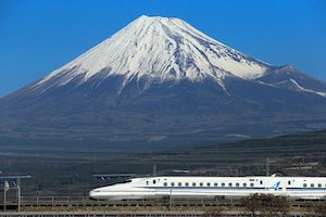 Photo of the Tokyo to Kyoto bullet train (shinkansen) in front of snow covered Mount Fuji.